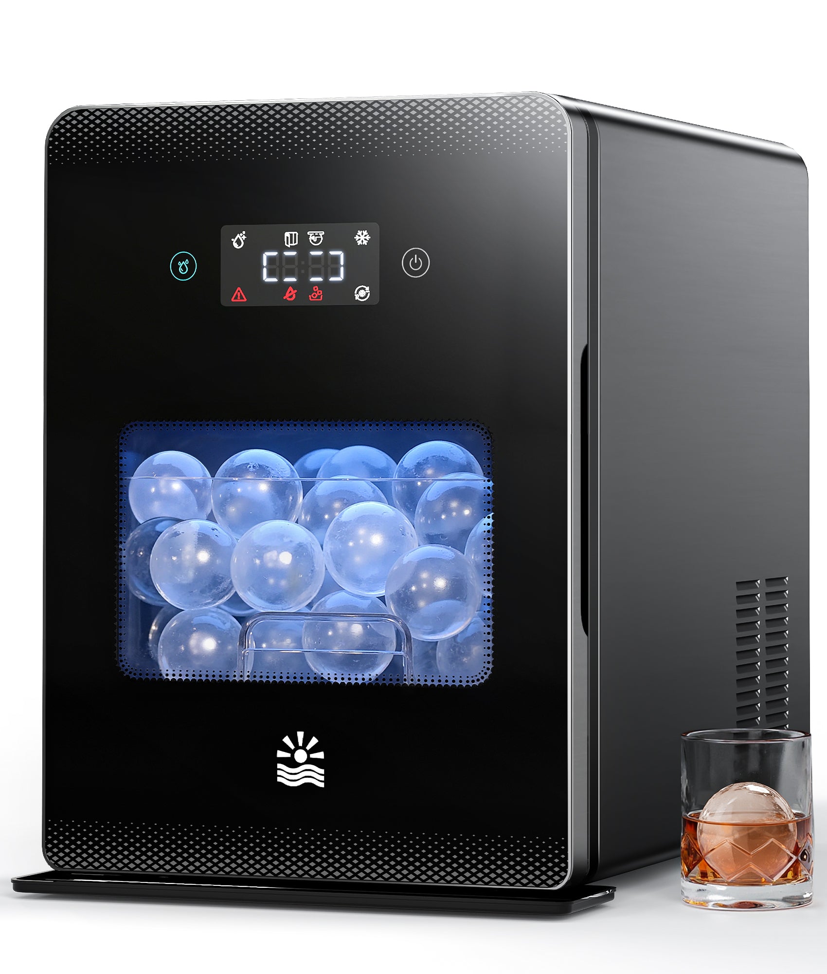 Black ice maker with digital display and ice cubes, next to a glass of whiskey with an ice cube.